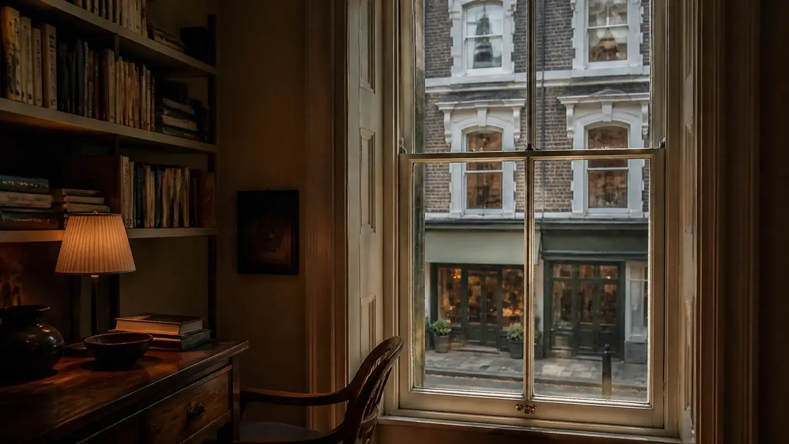 Interior of a London flat above a shop with acoustic secondary glazing behind a period window overlooking the street below
