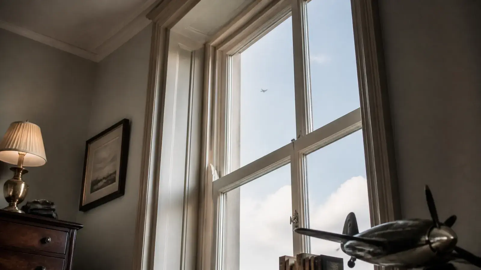 Calm heritage interior looking toward the sky through acoustic secondary glazing
