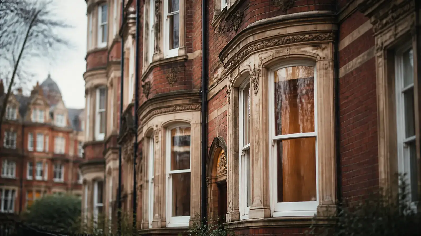 London mansion block exterior with original period windows in a refined urban setting London mansion block exterior with original period windows in a refined urban setting