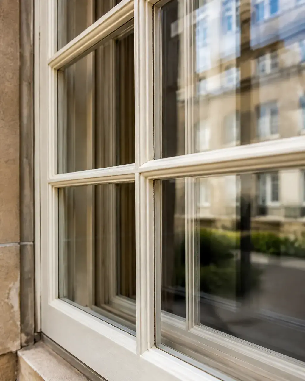 Detailed shot of delicate astragal bars on a Georgian sash window with discreet secondary glazing behind Detailed shot of delicate astragal bars on a Georgian sash window with discreet secondary glazing behind