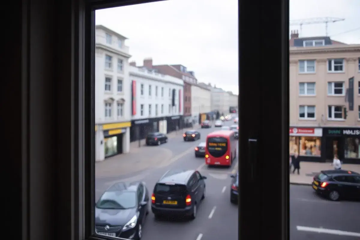 Heritage London sash window facing urban noise Heritage timber sash window overlooking a busy London street, highlighting the acoustic challenge