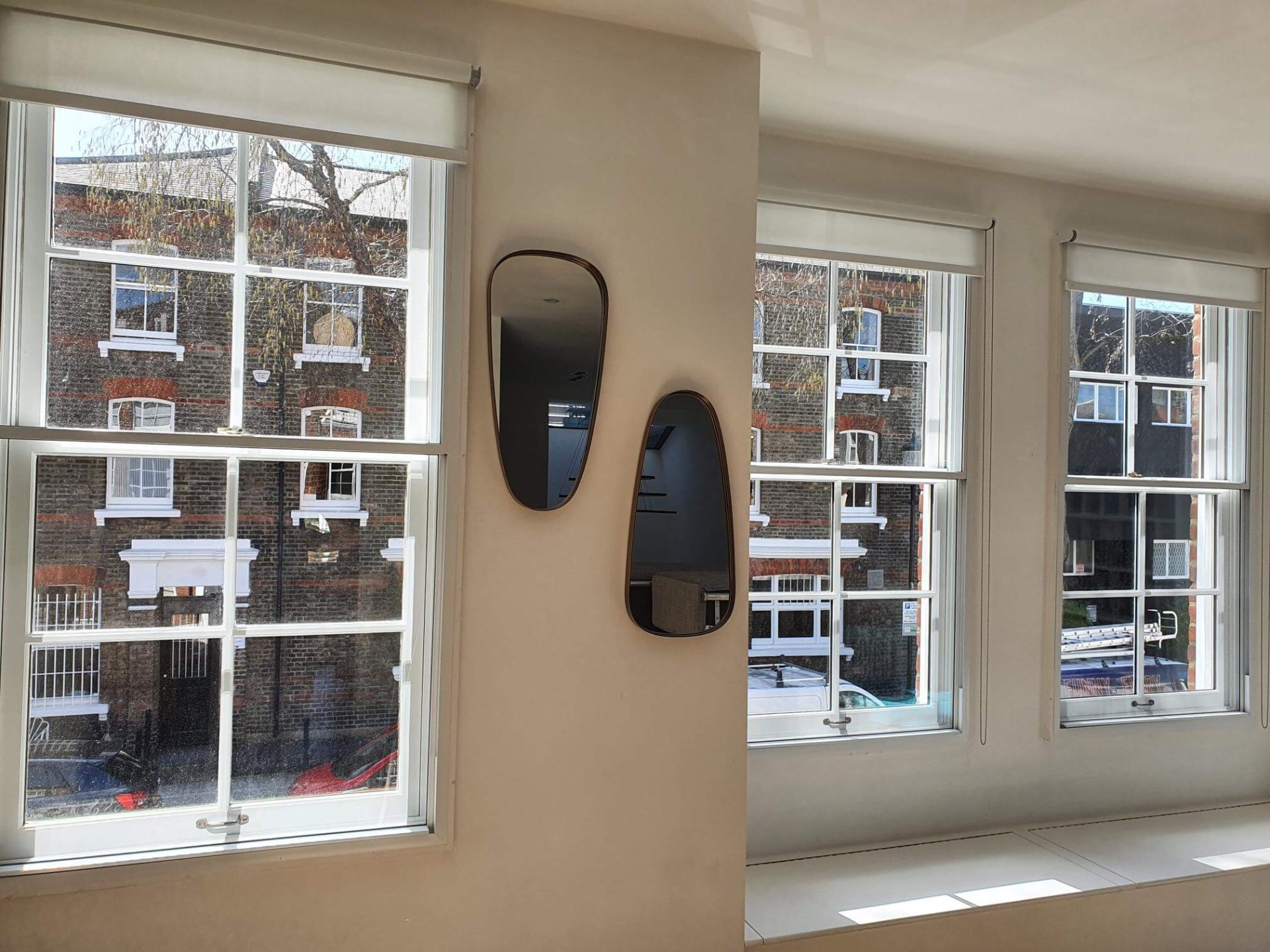 Acoustic secondary glazing installation on multiple Georgian sash windows in a Westminster corner room