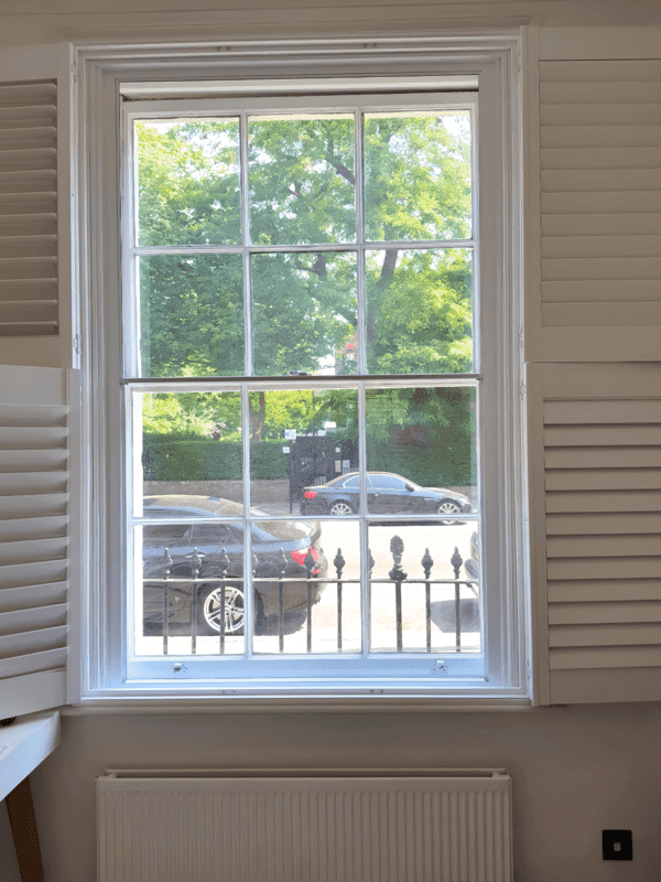 Acoustic secondary glazing for a sash window in a Kensington period home reducing street noise